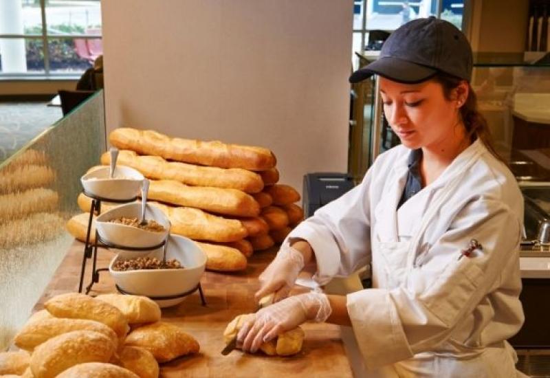 woman slicing bread