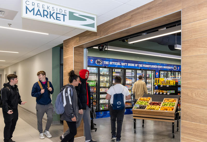 Students walking outside of Creekside Market at Berks campus