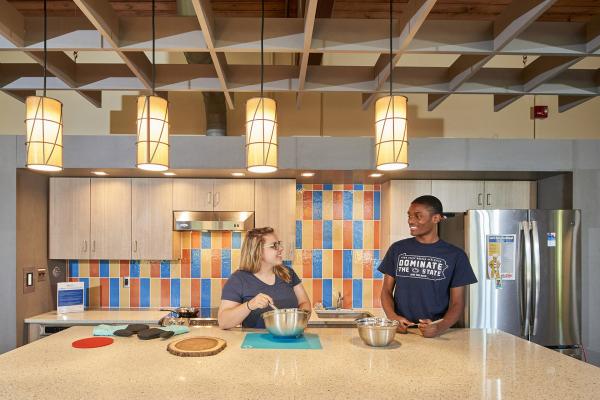 Students hanging out at the community kitchen