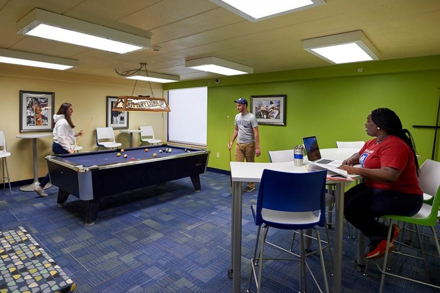 students playing pool at spruce hall