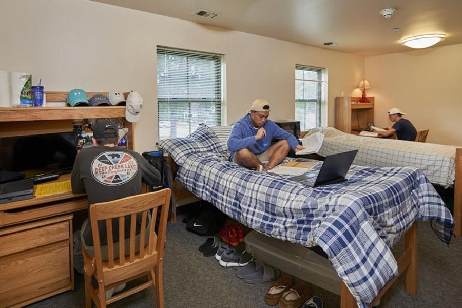 Room in Paxton House with three male students studying