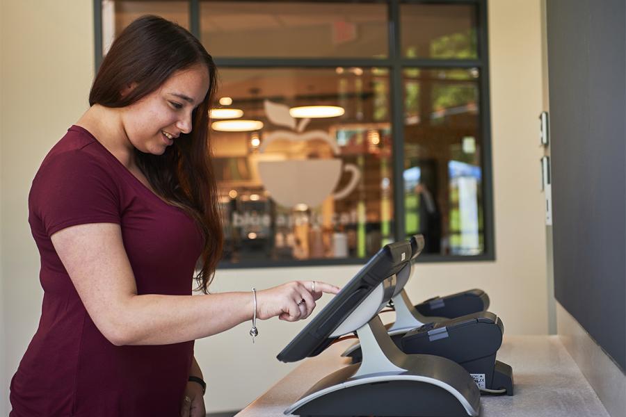 Student using the ordering kiosk