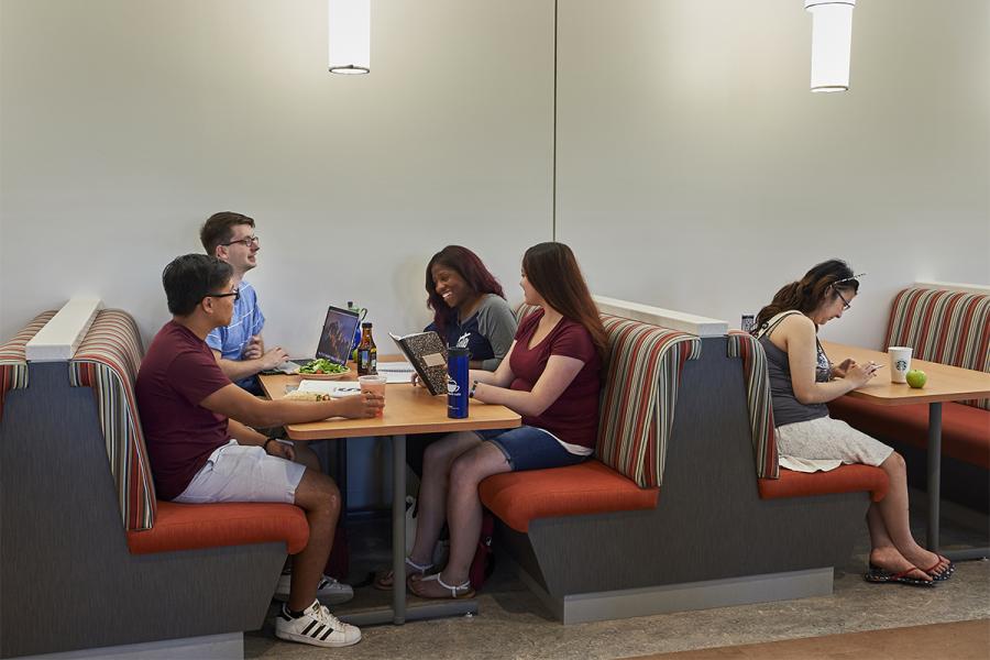 students in a booth at Blue Apple Cafe