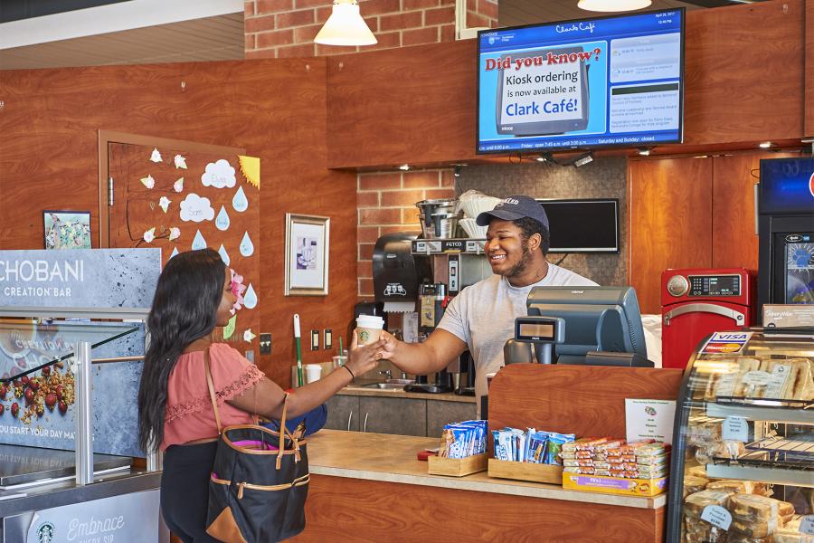 Clark Café with student purchasing coffee