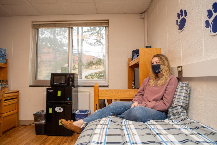 Bedroom with student sitting