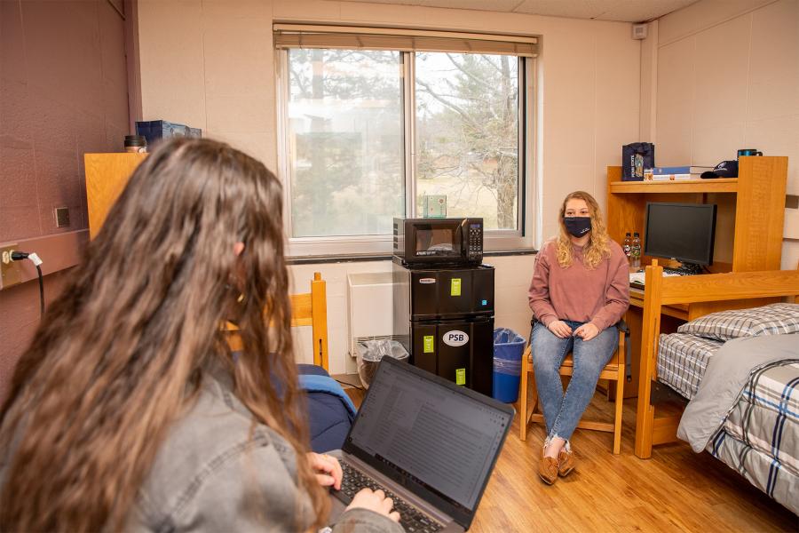 Double dorm with students talking