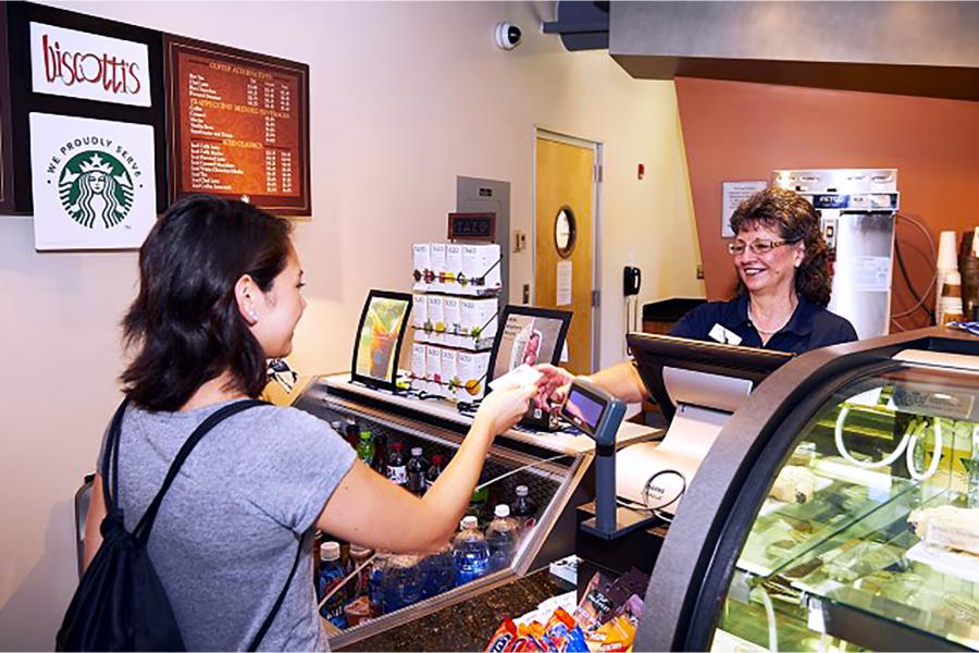 student receiving coffee from biscotti's