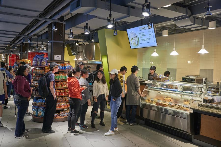 Students at the deli in Stacks