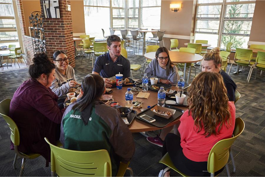 High Acres dinning room with a group of students