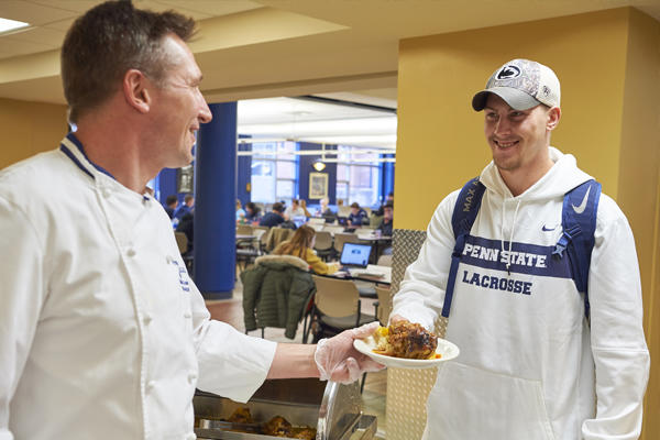 Student getting food in the dining hall
