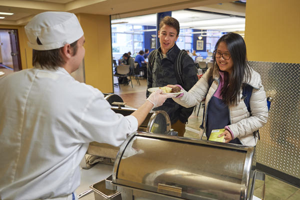 Student getting food in the dining hall