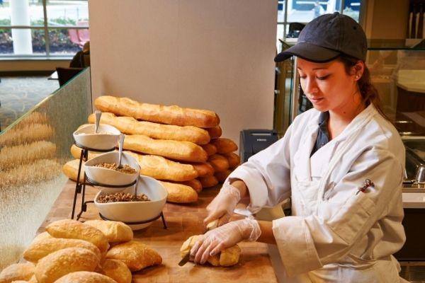 woman slicing bread