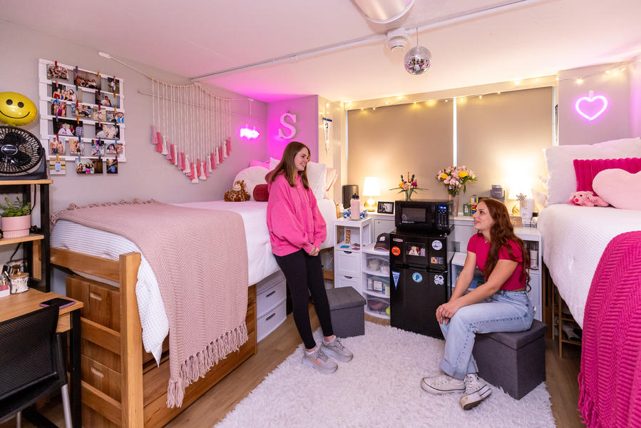 Interior, residence hall room, roommates talking