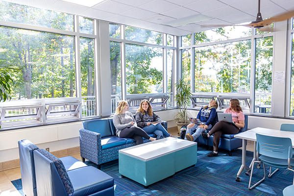 Students visit in the Oak Hall lounge