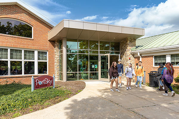 Students entering and departing exterior entrance of Port Sky Cafe