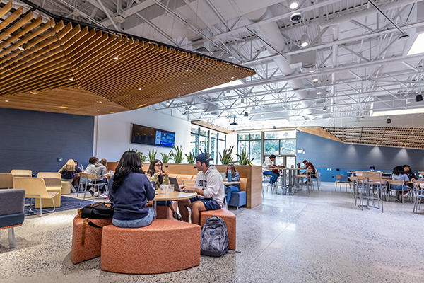 Students eating their meals and visiting in the Tully's dining room