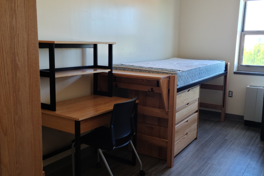 Robinson Hall room showing bed with dresser underneath, and desk