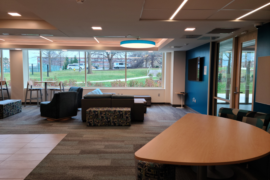 Stone Hall common area showing chairs and tables where students can hang out