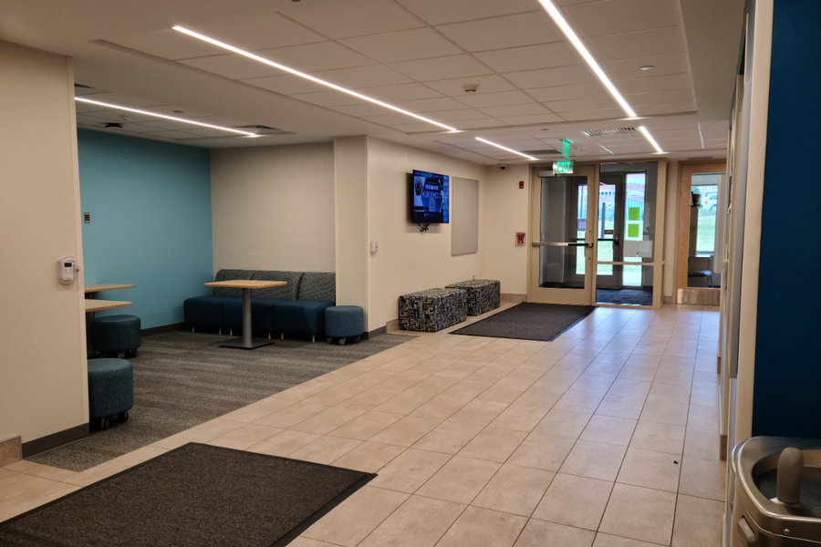 Stone Hall common area showing chairs and tables where students can hang out