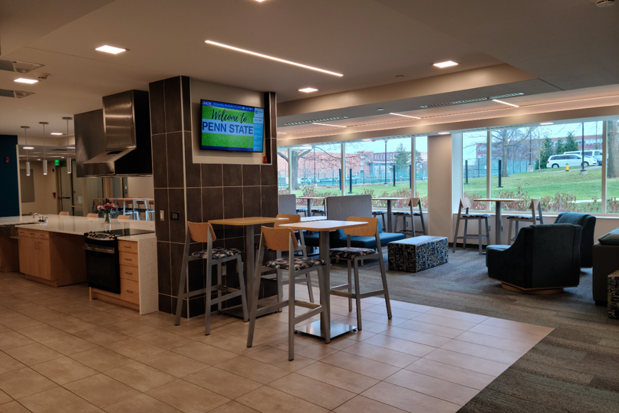 Stone Hall common area showing chairs and tables where students can hang out