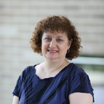 A smiling Dawn Massini in front of the residence hall