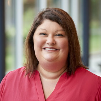 A smiling Jennifer McCutcheon inside the Student Community Center