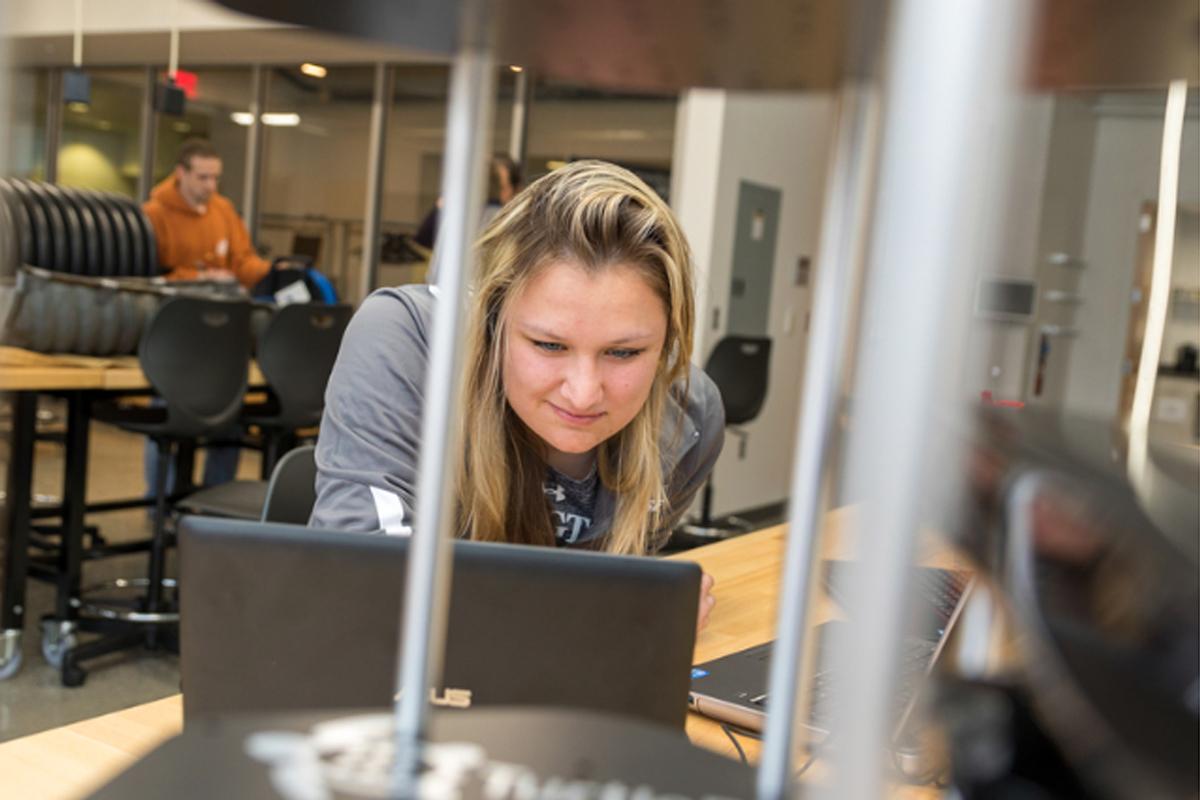 First-Year in Science & Engineering House (FISE) Girl looking at a laptop