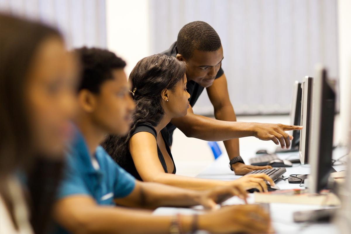Information Sciences and Technology House (IST) 4 students working in a computer lab