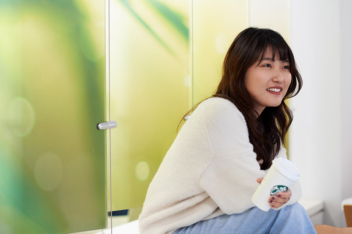 student enjoys her coffee