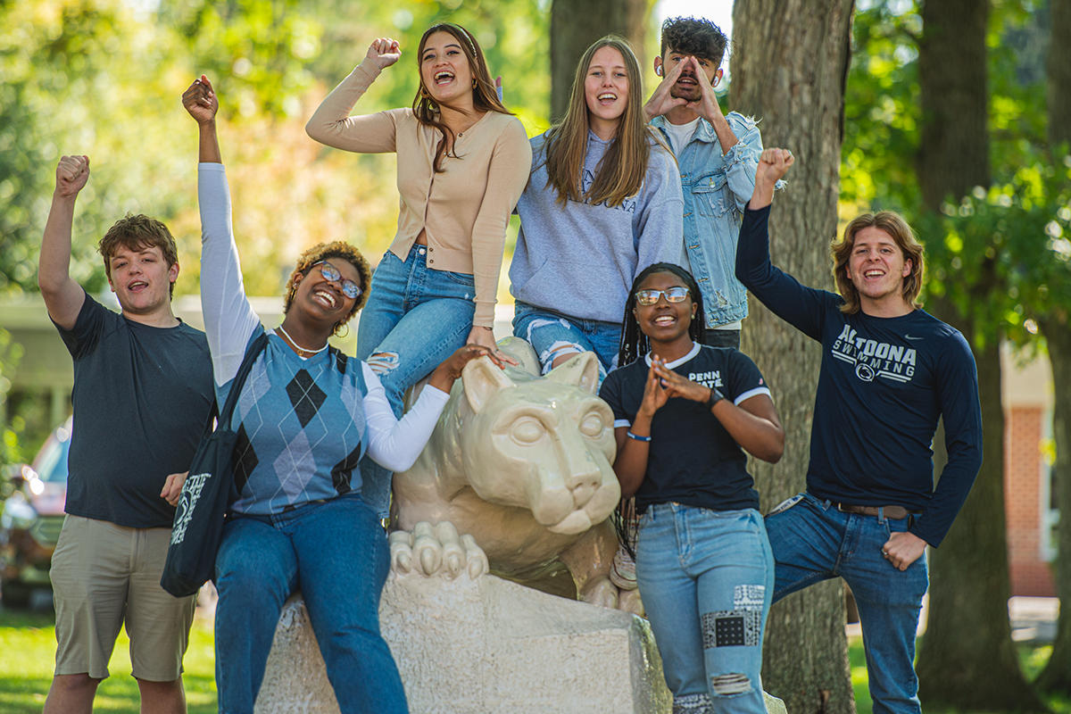 We Are Penn State Altoona Penn State Altoona students pose for a picture at the campus lion shrine