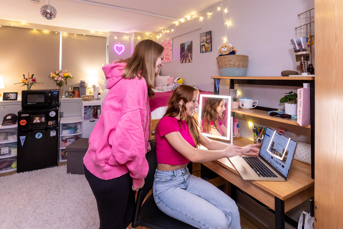 Interior, residence hall room, roommates researching
