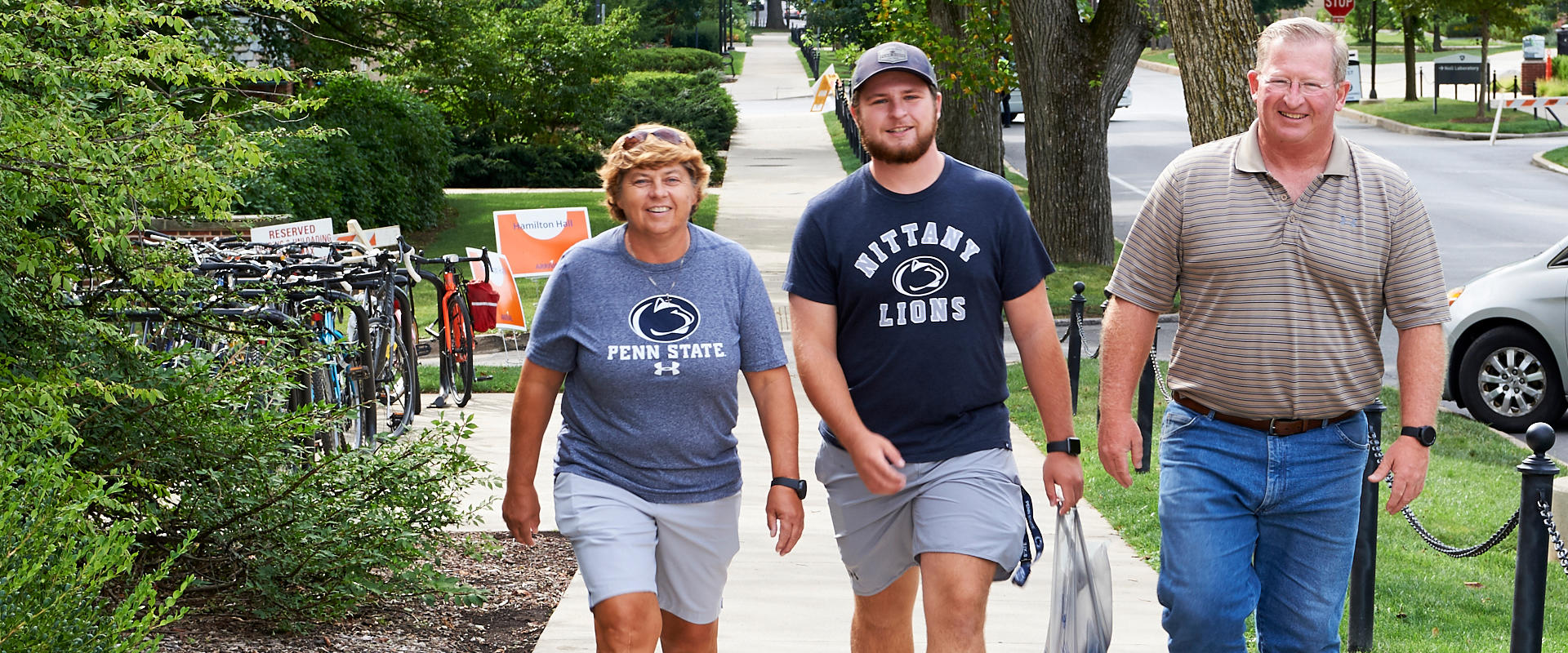 Parents walking with their student