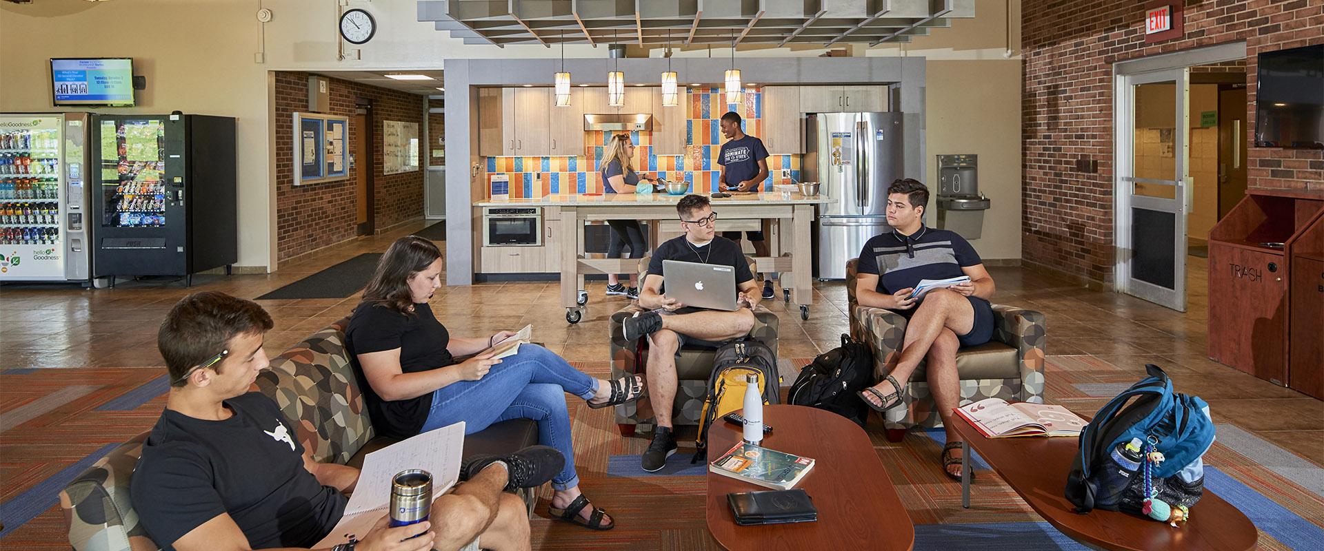 Students hanging out in Harmony Hall lobby