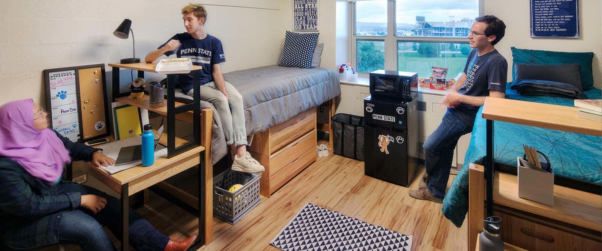 Students talking in a residence hall room