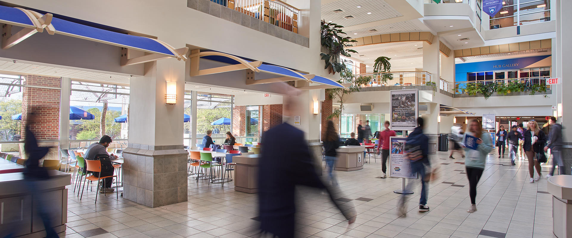People walking through the main thoroughfare of the HUB-Robeson Center